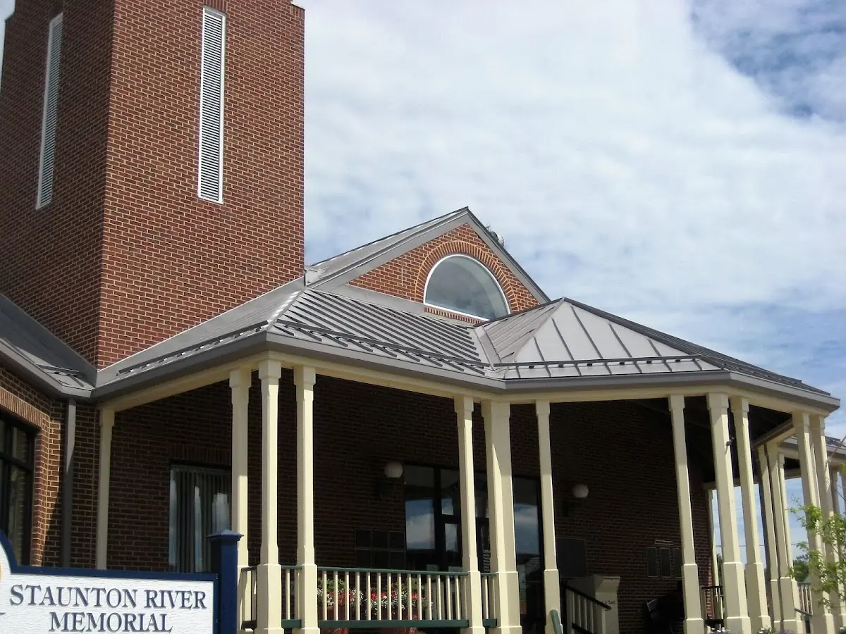Skilled roofing craftsmen working on a residential roof in Rochester